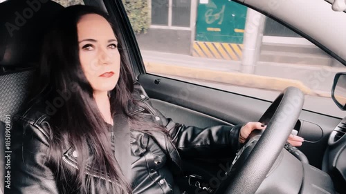 Modern woman content creator commuting by car in at sunset