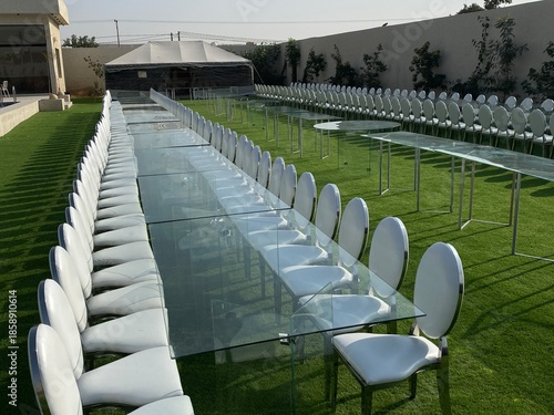 Outdoor party tables on green grass, weddings, events, companies