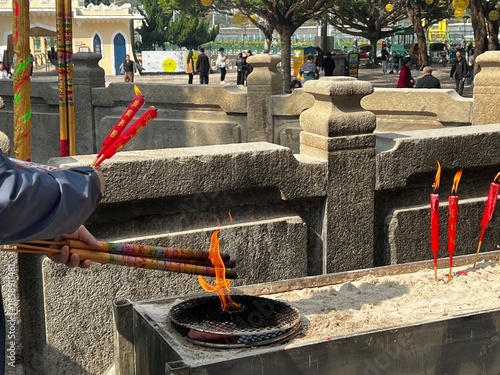 Religious ceremony taking place outa Buddhist temple