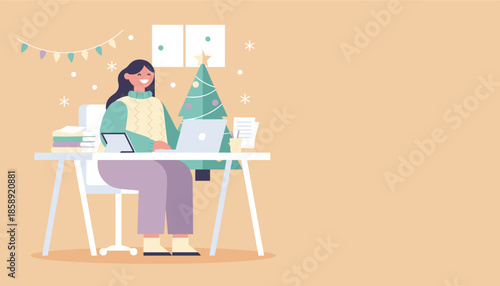 Smiling woman works remotely on a laptop in a cozy Christmasdecorated home office