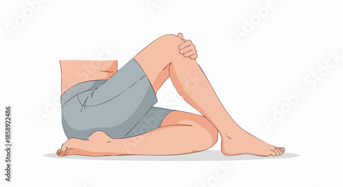 Person sitting with knees pulled to chest.