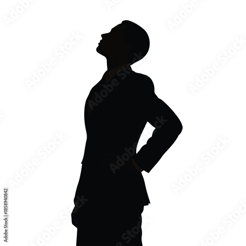 A professional individual in a dark suit gazes upwards in deep contemplation, shrouded in shadow
