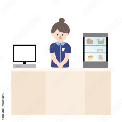 笑顔でレジに立っている女性のコンビニ店員