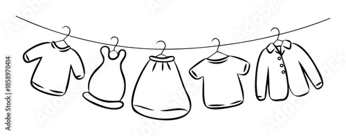 A collection of various garments including shirts, a dress, and a skirt, hanging on hangers from a clothesline, ideal for fashion, laundry, or clothing store promotional materials and