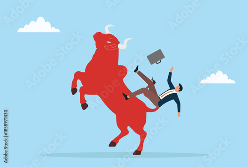 Vector illustration of a businessman losing balance on a red bull, illustrating market turbulence, financial risk, and unstable investments
