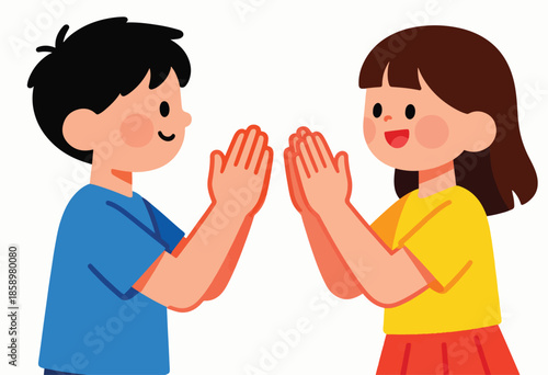 Two cheerful children, a boy and a girl, are playing patty-cake together