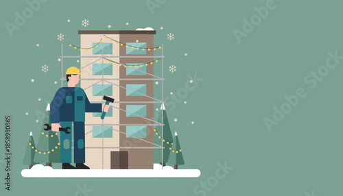 Holiday construction worker preparing a building exterior in the snow