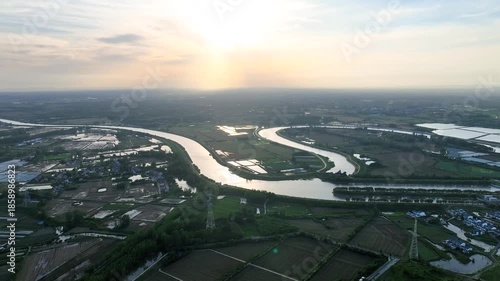 Rural Irrigation River Winding Through Countryside Fields And Villages 4K Aerial