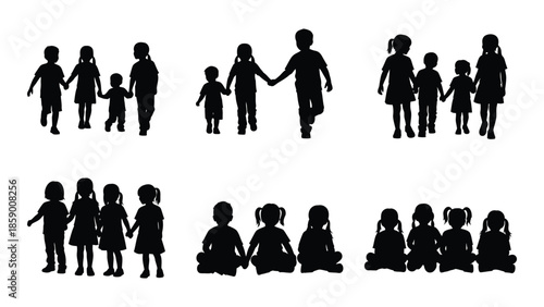 A group of silhouetted children holding hands symbolizing friendship and togetherness