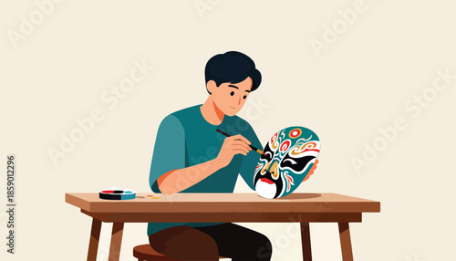 Person painting a colorful, traditional mask on a wooden table