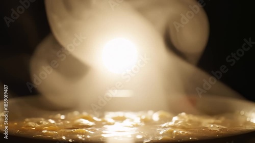 Hot Bowl Emits Smoke, Showcasing Delicious-Looking Steaming Food