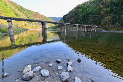 Aso Chinkabashi Submersible Bridge Over Mountain River in Kochi Prefecture, Shikoku Island. Rural River Landscape in Shikoku Island