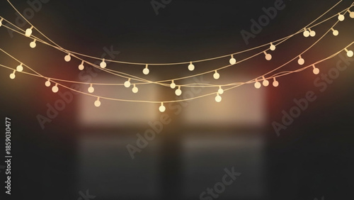A serene string of lights hanging in a dark room with a blurred background and soft illumination