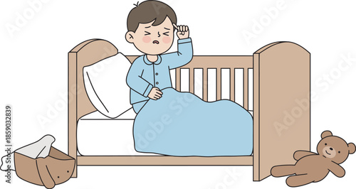 Toddler lying awake in bed with teddy bear at night