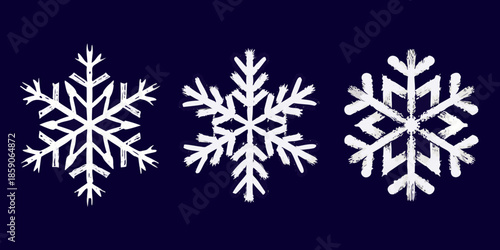 Three white chalk snowflakes illustrated against a dark navy blue background