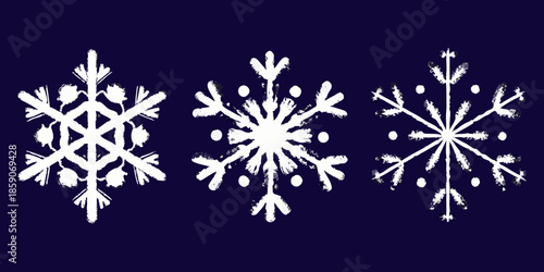 Three detailed white snowflakes against a dark navy blue background