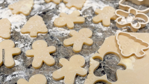 Sugar Cookies Being Rolled and Cut Out on the Kitchen Counter