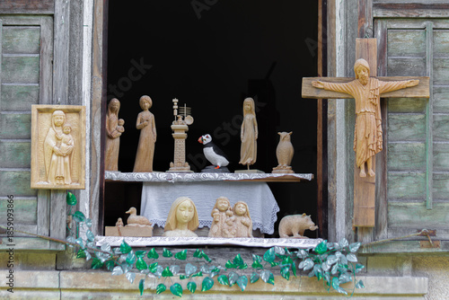 Wooden religious carvings, animals, and decorative figures