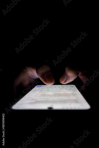 Night, cybersecurity and hands typing with phone for texting, internet troll or person cyberbullying. Dark comment, social media netizen or keyboard warrior, online bullying or hacking. vertical.