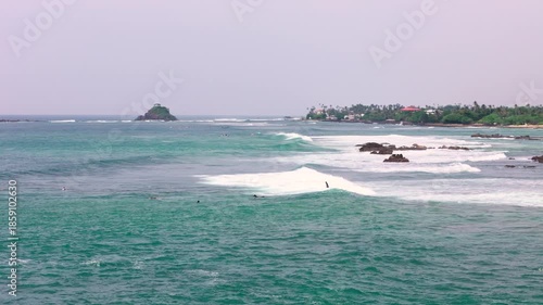 Surfer surfs for a short time on wave