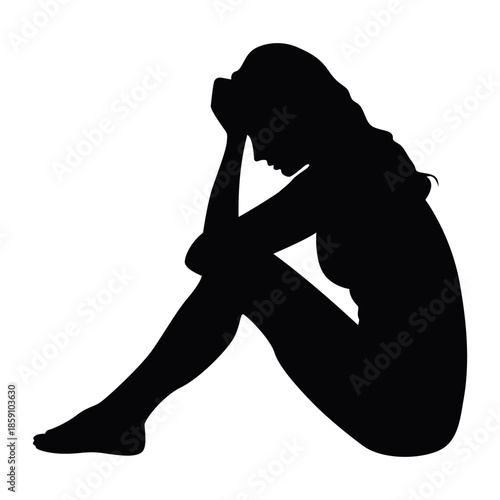 Silhouette of a depressed woman rests head on hand