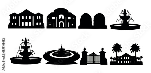 Silhouetted buildings and fountains at night with illuminated gate