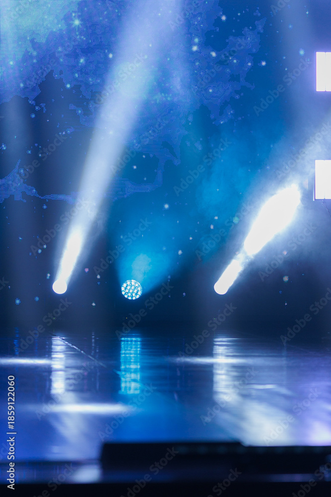 Obraz premium An empty stage of the theater, lit by spotlights and smoke before the performance