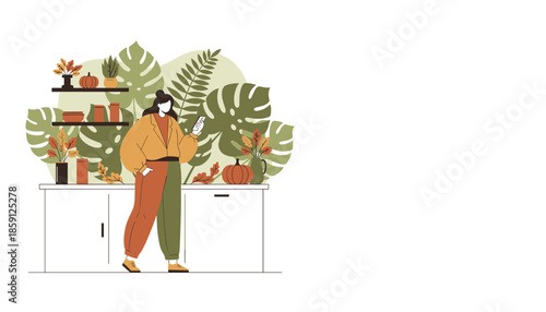 Woman using smartphone in a stylish modern home decorated with autumn accents and green plants
