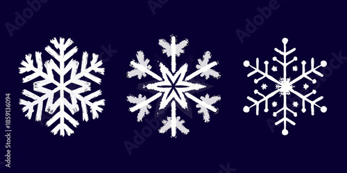 Three detailed white snowflakes on a dark navy blue background