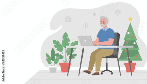 Smiling senior man using a laptop at his desk next to a Christmas tree Remote work during the holidays