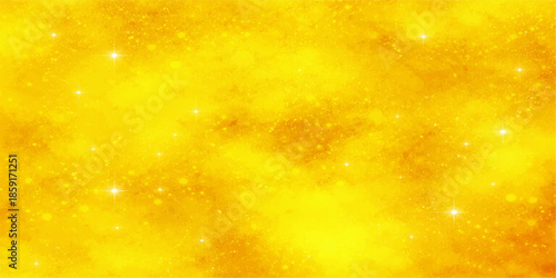 Abstract golden and orange Christmas background with bright bokeh stars and shiny snow sparkles for a festive winter holiday design