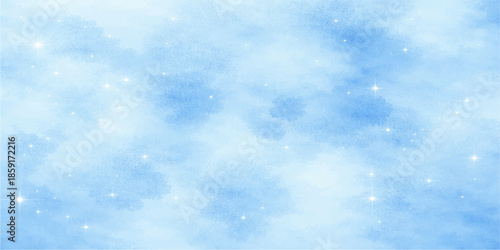 A bright blue abstract sky background featuring fluffy white clouds and beautiful sunlight filtered through falling snowflakes in a clear summer atmosphere