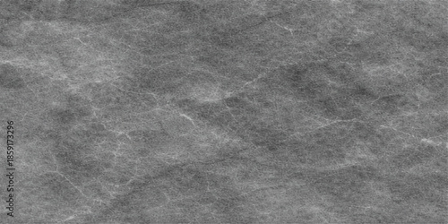 Dark grunge black and white fabric texture with vintage grey leather pattern on a rough old paper surface creates a blank textured backdrop designDark grunge black and white fabric texture with vintag