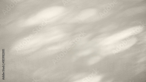 Minimal beige wall background with soft natural light and shadow overlay creating. Perfect for product mockups or presentation templates