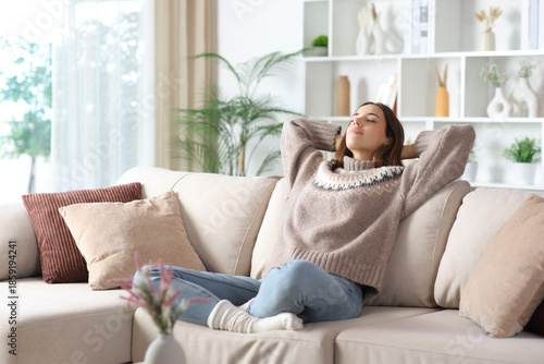 Canvas Print Relaxed woman in winter enjoying free time at home