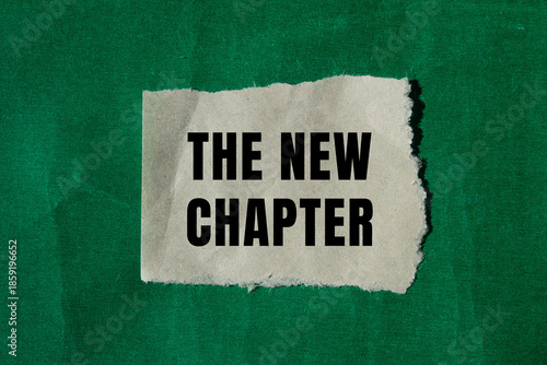 Fotografie The new chapter message written on ripped torn paper background