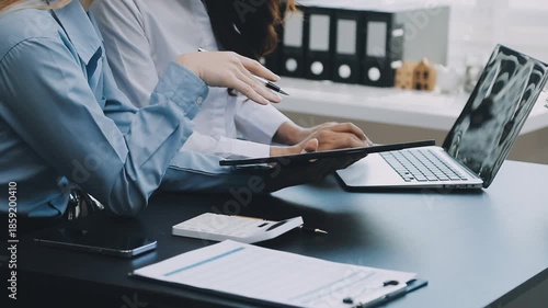 Human use calculator and calculate bills and paying bill, credit card, tax and vat, payment, concept of money management and business report with financial documents, financial accounting concept