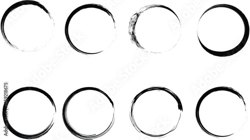 Set of abstract black ink brush stroke circles and hand drawn enso rings isolated on white background for design