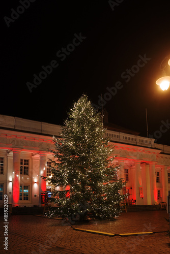 Night view of a beautifully illuminated Christmas tree on the market square in Schwerin, Germany.