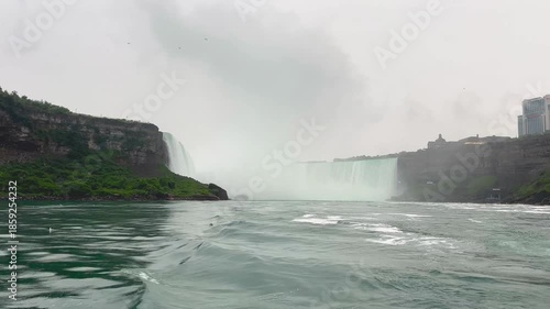 Breathtaking landscape of Niagara Falls waterfalls surrounded by lush nature and river