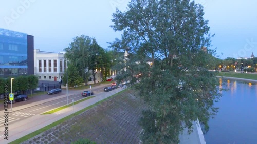 Riga aerial skyline at night along the city river, Latvia