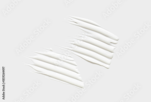 cosmetic smear of creamy texture on gray background