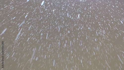 Falling snow. Snowing in the street, winter background. Beautiful winter landscape.