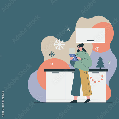 Woman uses tablet in a winterthemed home kitchen focusing on technology remote work or holidays
