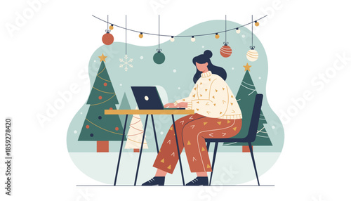 Woman working remotely on a laptop during the festive Christmas holiday season cozy home office