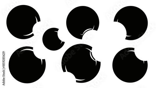 Abstract illustration of multiple black circles with bite marks and copy space