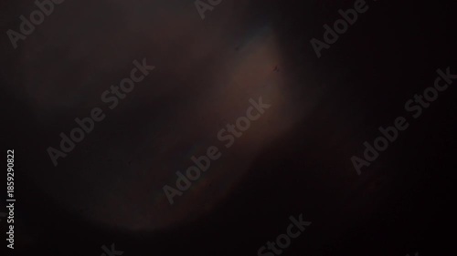 glare of light in the lens on a black background	