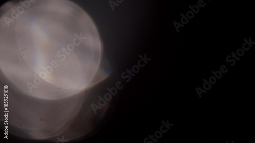 glare of light in the lens on a black background	