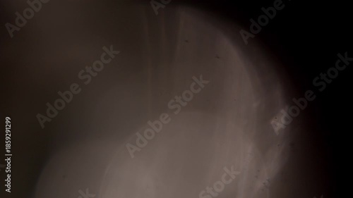 glare of light in the lens on a black background	