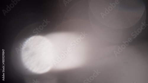 glare of light in the lens on a black background	